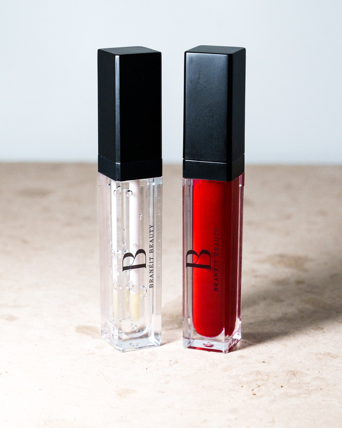 lip gloss with led light feature and mirror tinted and clear red