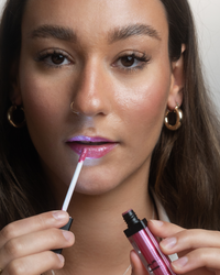 lip gloss glitter with led light feature and mirror girl using