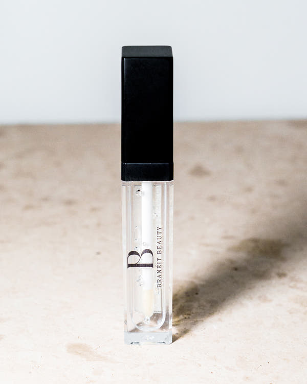 lip gloss with led light feature and mirror tinted and clear red